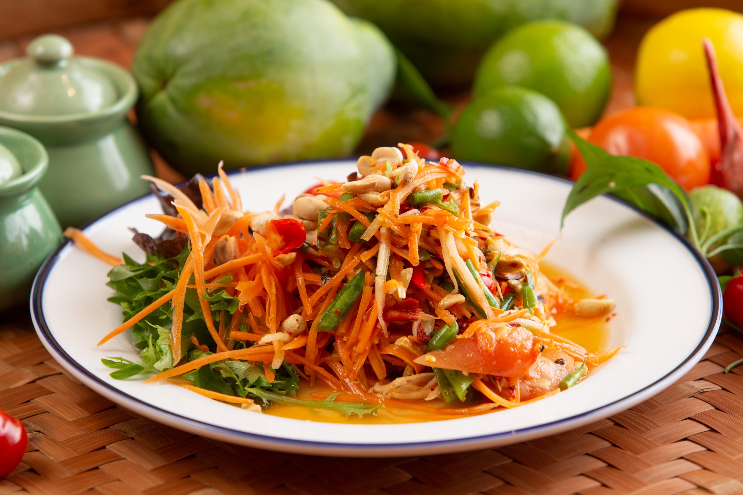 A colourful Thai feast centred on green papaya salad